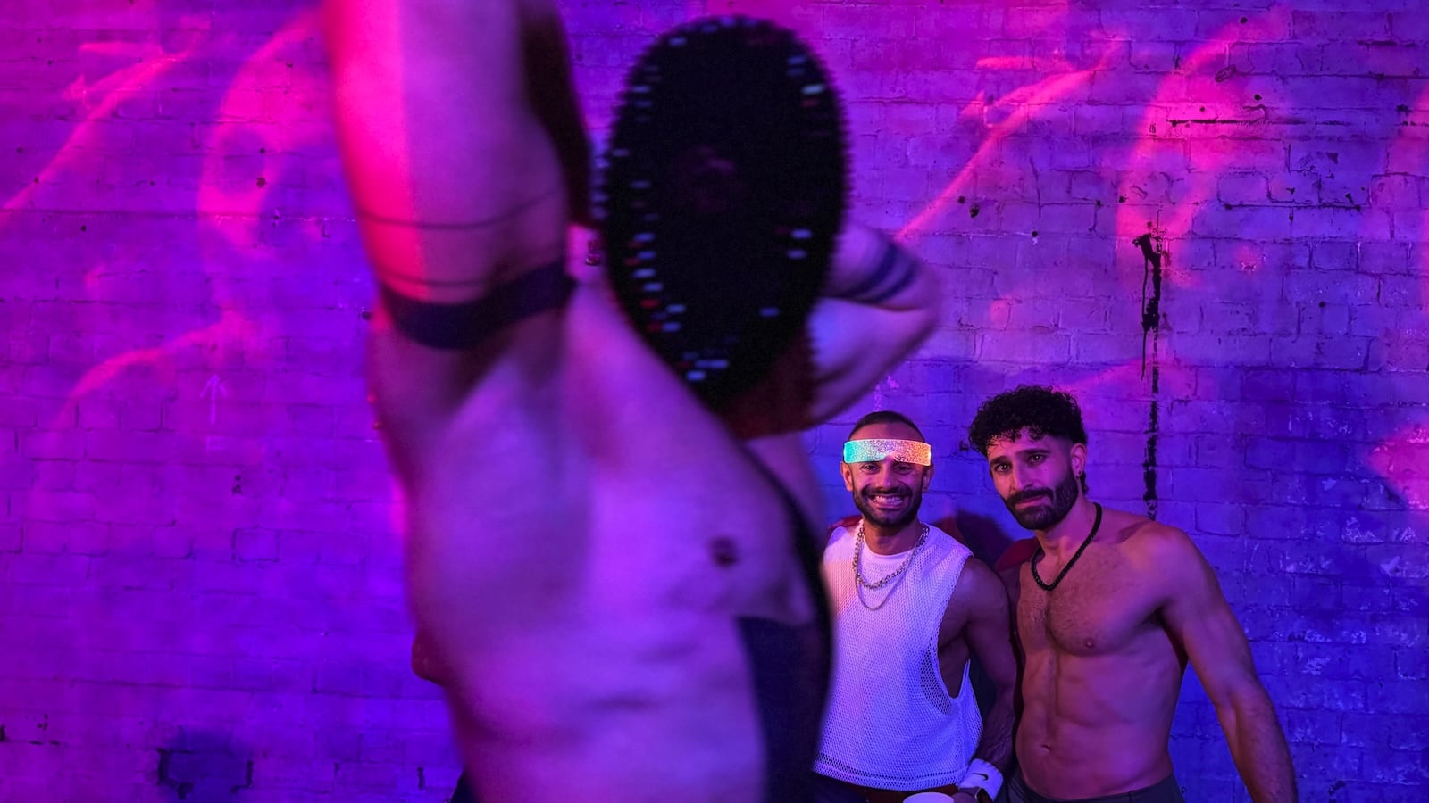 Homobloc Manchester wall and masked performer.