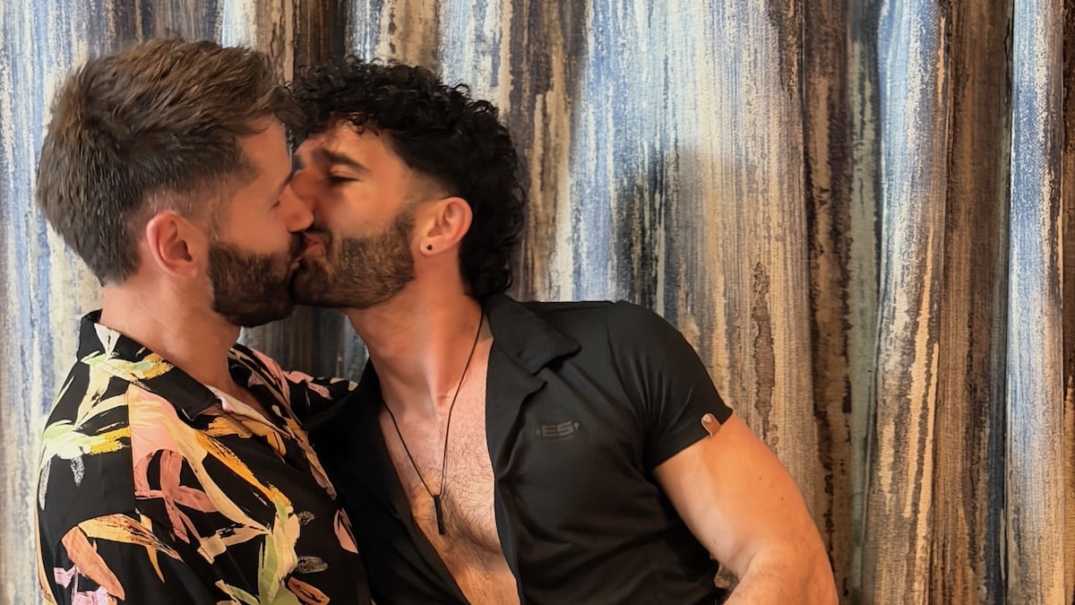 Stefan and Seby kissing on the Mein Schiff ship.