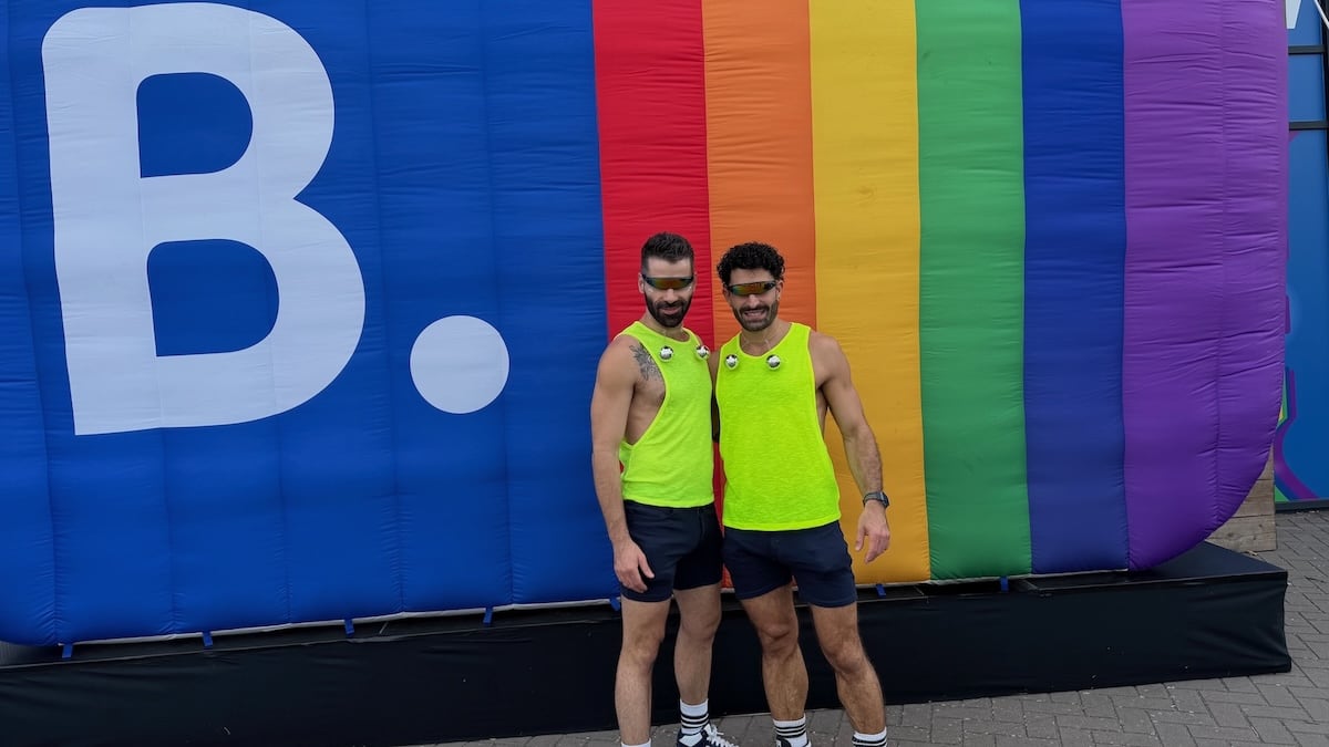 Gay couple Nomadic Boys at the Travel Proud BookingCom event at Amsterdam WorldPride.