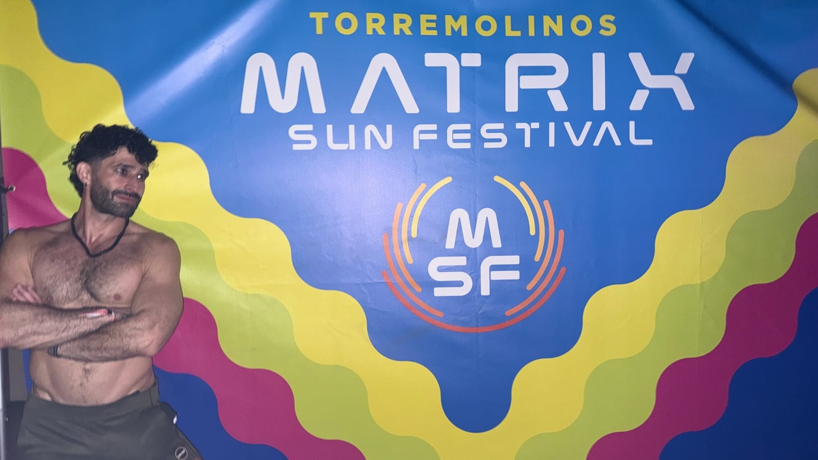 Stefan posing by the Matrix Sun Festival sign.